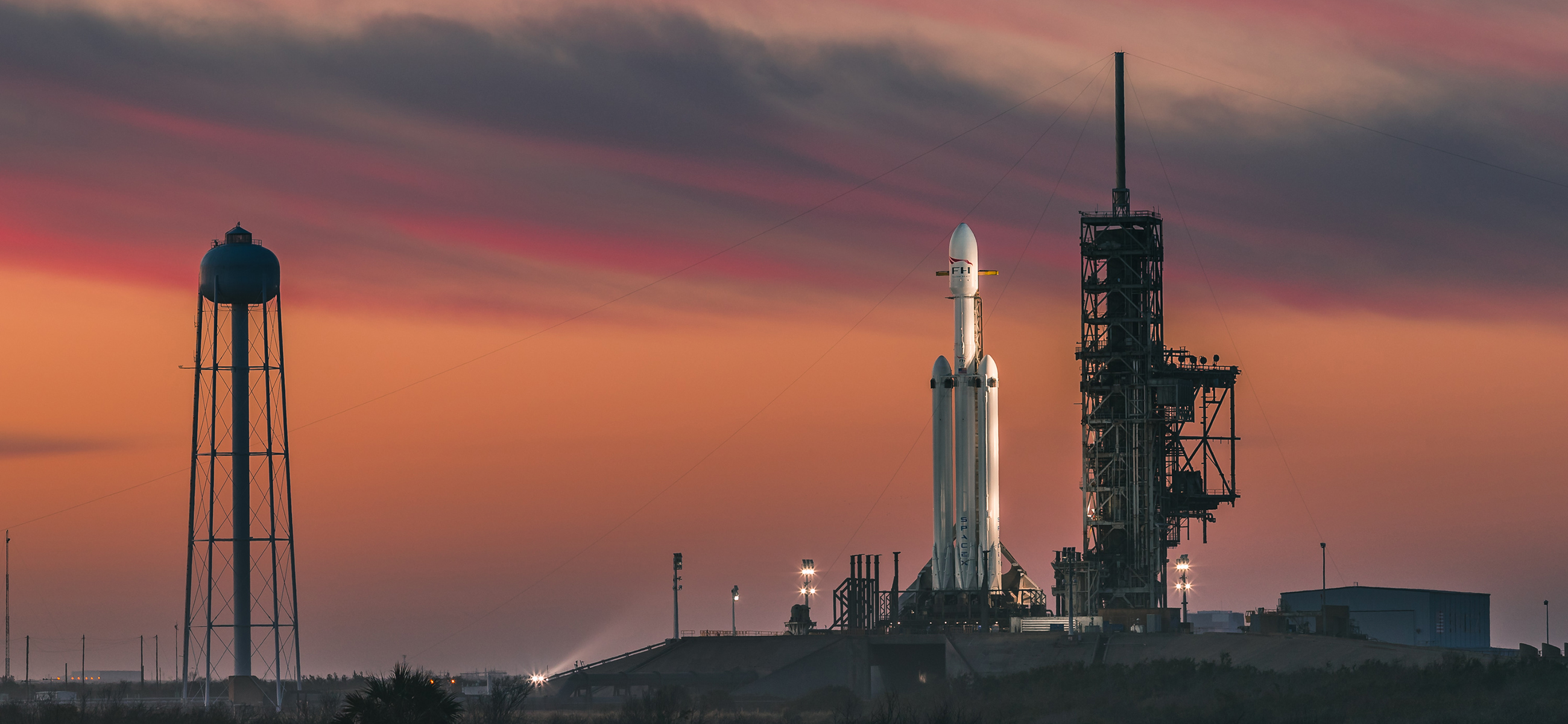 Falcon Heavy vertical at Kennedy Space Center- credits: https://www.spacex.com/vehicles/falcon-heavy/